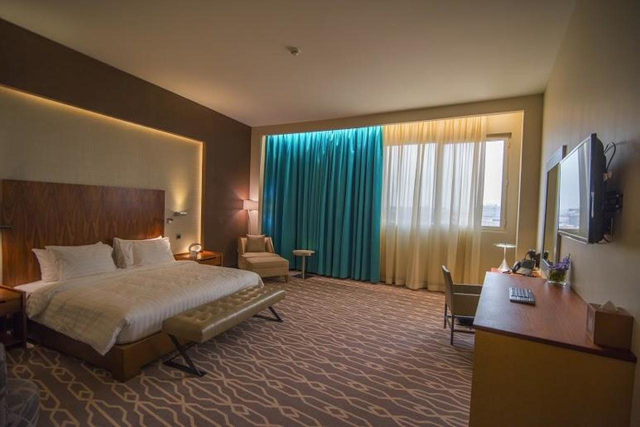 Millennium Hail Hotel Eksteriør bilde A room at the hotel